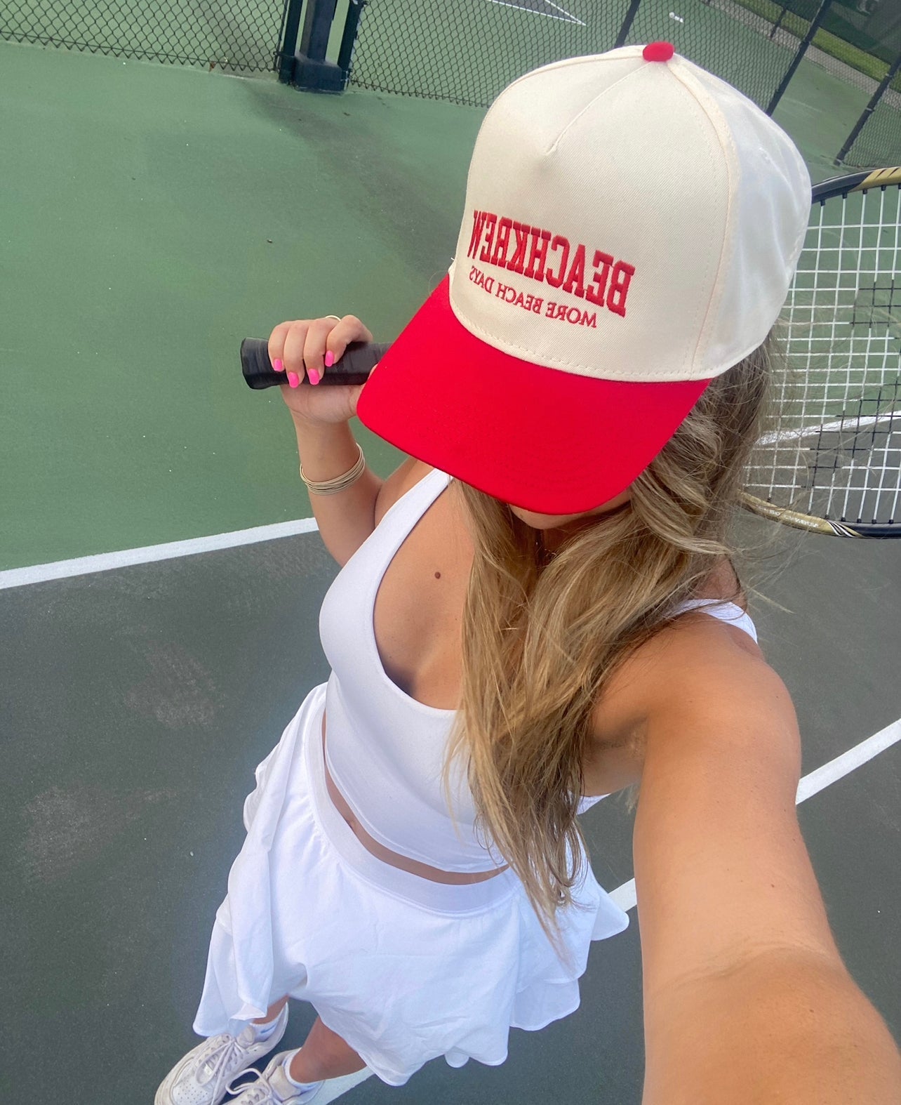 red varsity hat